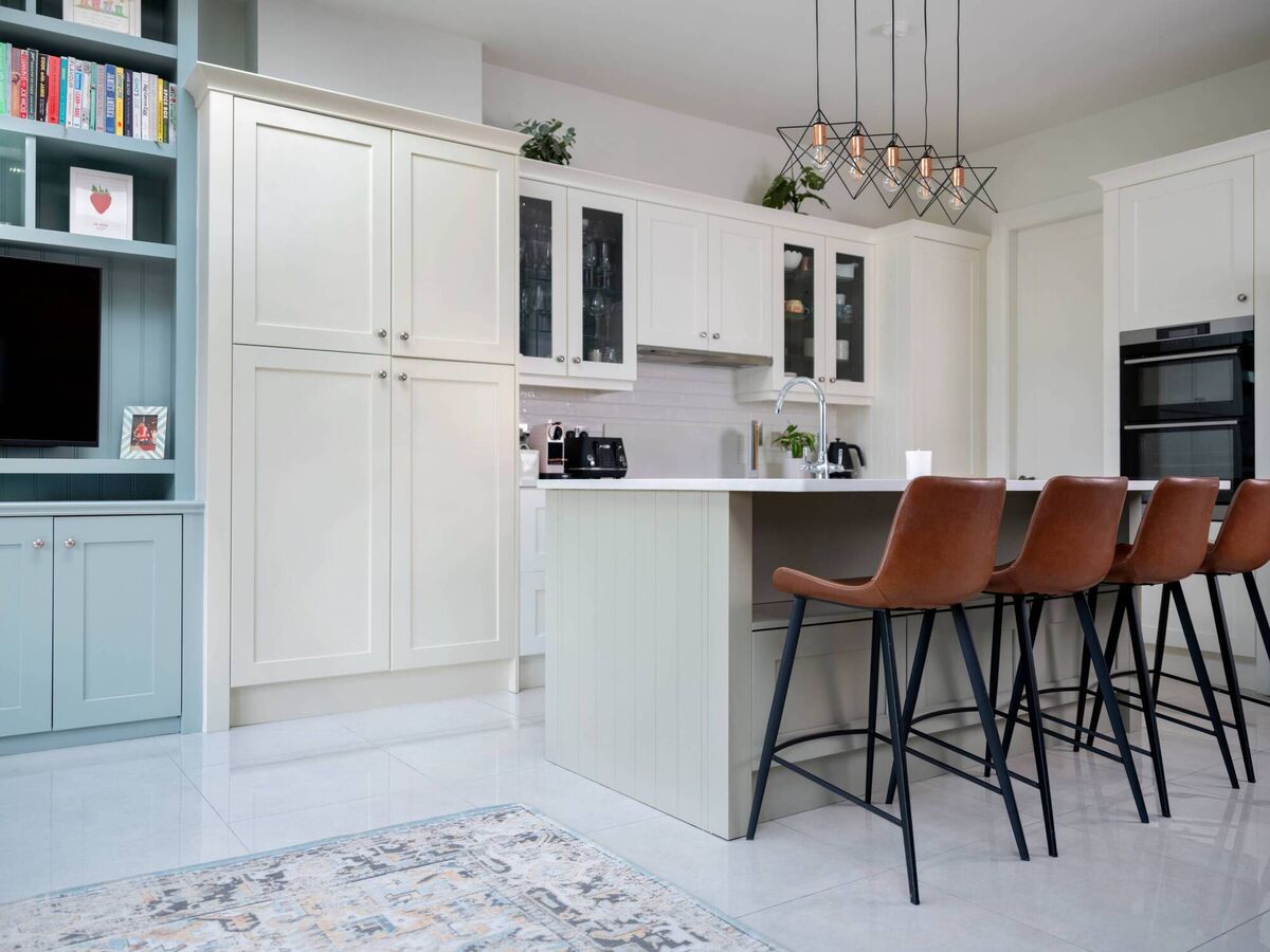 The island she painted in Dulux Heritage Setting Stone, while cabinets are Fresh Flour 